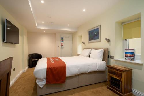 Amsterdam Hotel Brighton Seafrontにあるテレビまたはエンターテインメントセンター