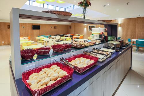 a buffet line with many different types of food at Rede Andrade Docas in Belém