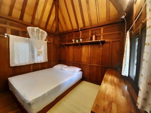 Postel nebo postele na pokoji v ubytování rumah566
