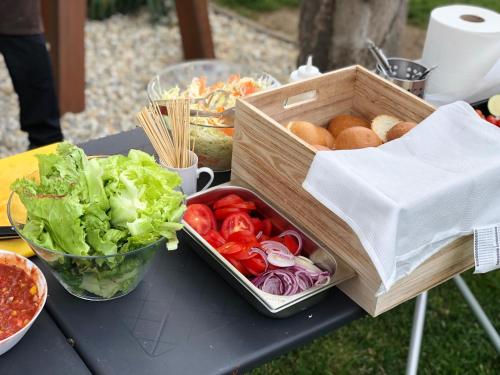 a crate of vegetables and bread on a table at Aqua & Wellness resort Alzbeta in Liptovský Mikuláš