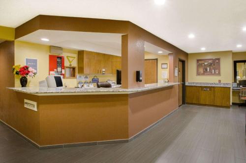 a lobby of a hospital with a reception counter at Days Inn by Wyndham Fremont in Fremont