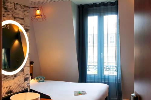 Ένα ή περισσότερα κρεβάτια σε δωμάτιο στο Ibis Styles Hotel Paris Gare de Lyon Bastille