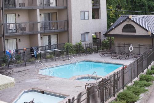 a swimming pool in front of a apartment building at Olde Gatlinburg Rentals in Gatlinburg