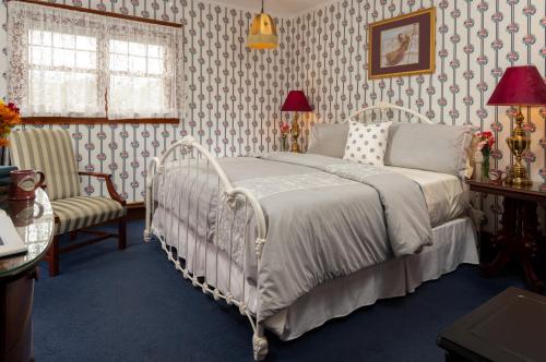Ένα ή περισσότερα κρεβάτια σε δωμάτιο στο Palmer House Inn