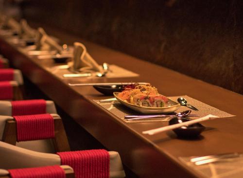 a row of tables with plates of food on them at Paradise Village in Nuevo Vallarta 