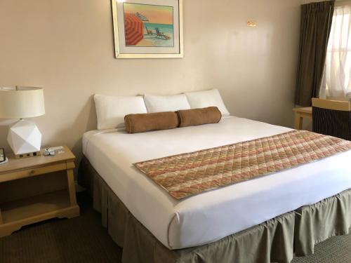 Postel nebo postele na pokoji v ubytování Beach Place Hotel
