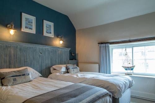Postel nebo postele na pokoji v ubytování Moors Inn