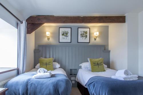 Posteľ alebo postele v izbe v ubytovaní Moors Inn