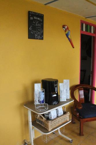 a room with a table with a coffee maker on it at ALOJAMIENTO MI TESORITO in Filandia