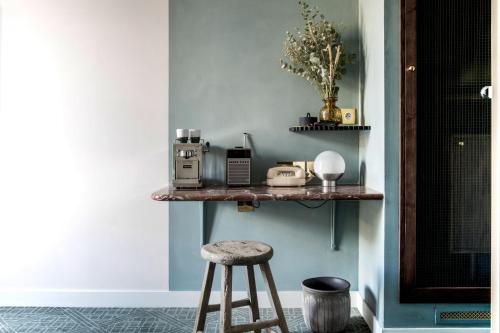 a stool sitting on a shelf in a room at Grands Boulevards Experimental in Paris