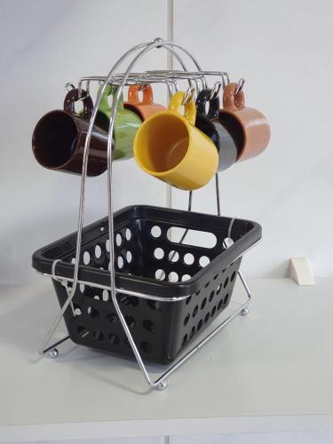 a shopping basket filled with different types of shoes at Casa do Maneco in Fernando de Noronha