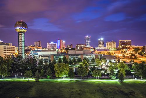 a city skyline at night with a park and a tower at Crowne Plaza Knoxville Downtown University by IHG in Knoxville