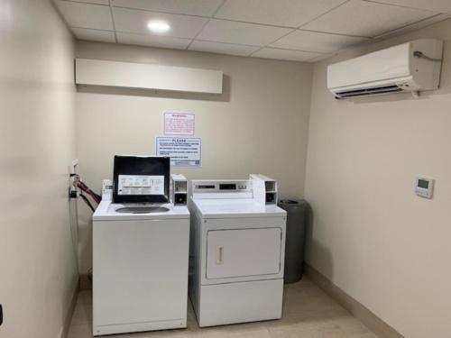 a hospital room with a laptop computer on a counter at Holiday Inn Express Tampa-Brandon by IHG in Brandon