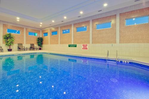 a large swimming pool in a hotel room at Holiday Inn Express Dryden, an IHG Hotel in Dryden