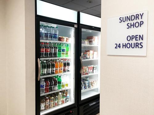 a refrigerator filled with different types of drinks at Holiday Inn Express Hotel & Suites White River Junction by IHG in White River Junction