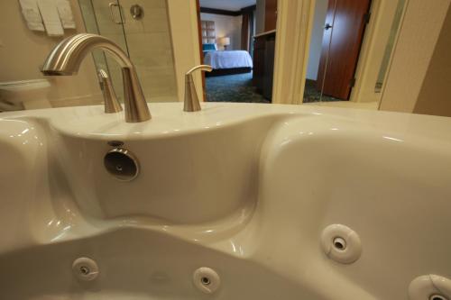 a white sink with a faucet in a bathroom at Ute Mountain Casino Hotel in Towaoc
