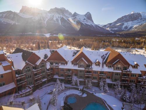 an aerial view of a resort with snow covered mountains at Stoneridge Mountain Resort in Canmore