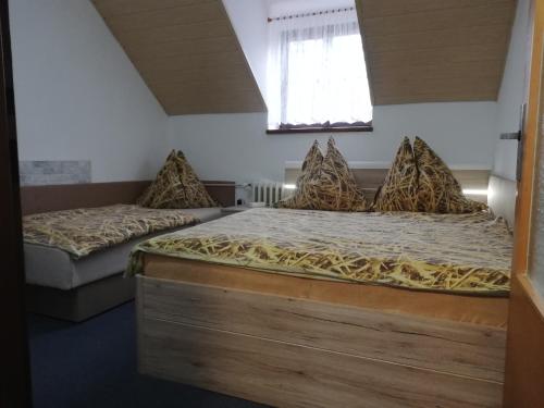 a bedroom with two beds and a window at Apartmany Železná Ruda in Železná Ruda