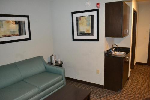 a living room with a couch and a sink at Holiday Inn Express Selinsgrove by IHG in Shamokin Dam