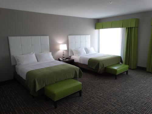 a hotel room with two beds and a window at Holiday Inn Covington, an IHG Hotel in Covington