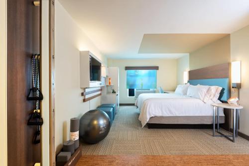 a hotel room with a bed and a television at EVEN Hotel Norwalk by IHG in Norwalk