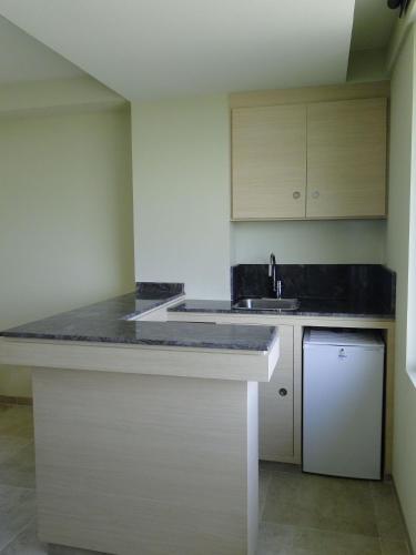 a kitchen with a sink and a counter top at Holiday Inn Coatzacoalcos by IHG in Coatzacoalcos