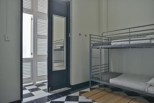 Postel nebo postele na pokoji v ubytování Fortel Hostel