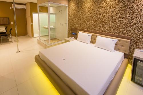 Ένα ή περισσότερα κρεβάτια σε δωμάτιο στο MOTEL CLASS