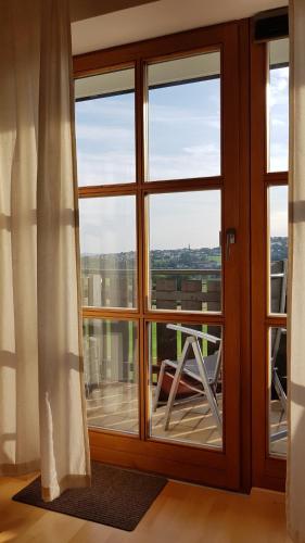a glass door with a view of a balcony at Appartement Hauzenberg-Panorama in Hauzenberg