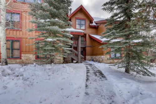 a house with snow in front of it at Trappers Crossing 8763 in Keystone