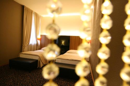 Postel nebo postele na pokoji v ubytování Hotel Crystal