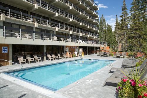 a large swimming pool in front of a building at The Lodge at Snowbird in Alta