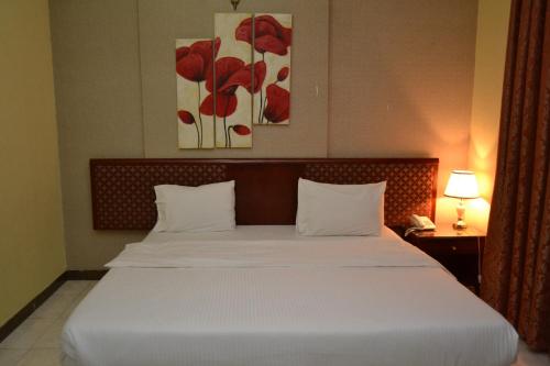 Posteľ alebo postele v izbe v ubytovaní Al Zain Hotel