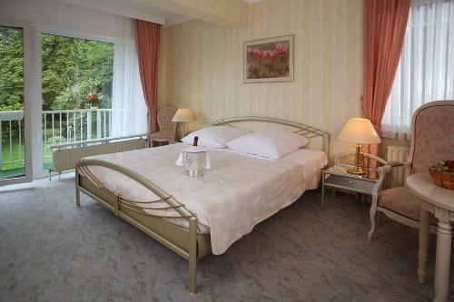 Säng eller sängar i ett rum på Hotel Meyer