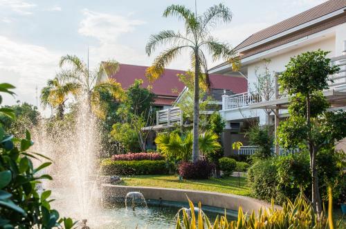 a fountain in front of a building at Tonwa Resort Hotel in Khon Kaen