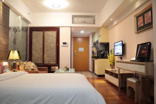 Krevet ili kreveti u jedinici u objektu Guangzhou Victory Apartment