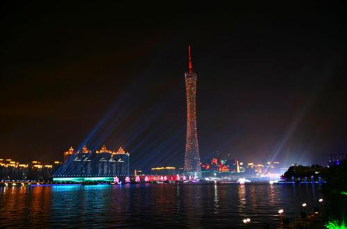 a view of the eiffel tower lit up at night at Guangzhou Victory Apartment in Guangzhou