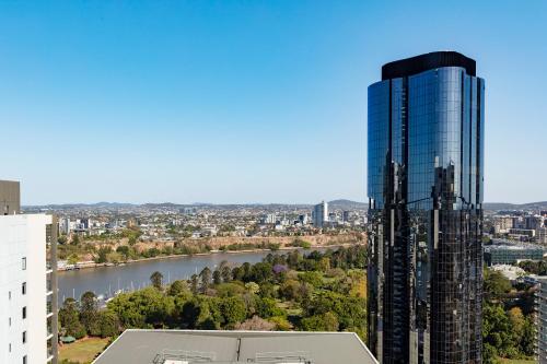 
a city with tall buildings and a large clock tower at iStay River City Brisbane in Brisbane
