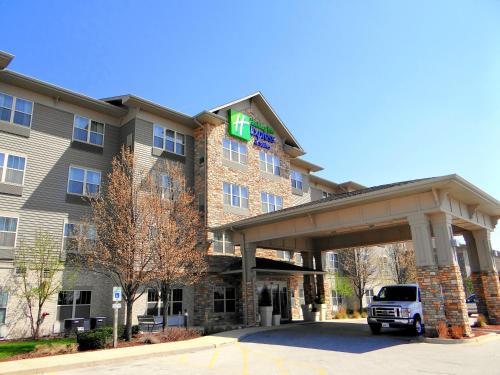 a hotel with a truck parked in front of it at Holiday Inn Express Hotel & Suites Chicago West Roselle by IHG in Roselle