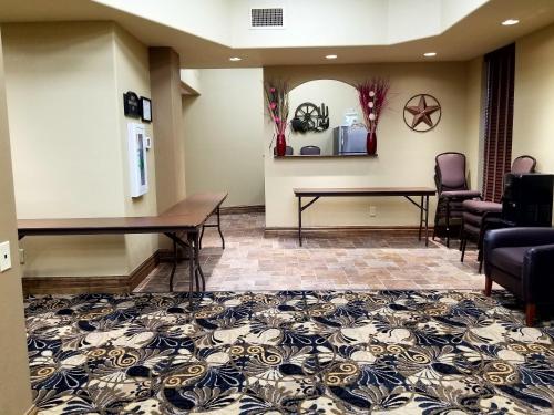 a living room filled with furniture and chairs at Candlewood Suites San Antonio Downtown, an IHG Hotel in San Antonio