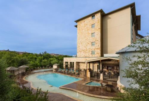 a view of the pool at a resort at Holiday Inn San Antonio Northwest- SeaWorld Area by IHG in San Antonio