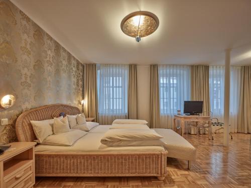 Säng eller sängar i ett rum på Lodner Hotel Drei Mohren