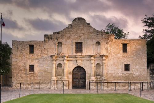 an old stone building with a door in the front at Staybridge Suites San Antonio Downtown Convention Center by IHG in San Antonio