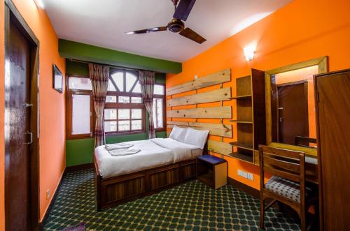 Postel nebo postele na pokoji v ubytování Hotel Pomelo House Inn