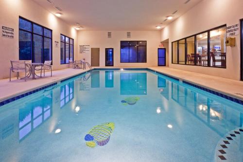 a large swimming pool with blue water at Holiday Inn Express Ringgold - Chattanooga Area by IHG in Ringgold