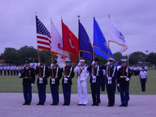 a group of men in uniform standing in front of flags at Staybridge Suites San Antonio Downtown Convention Center by IHG in San Antonio