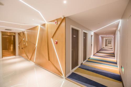 a corridor in a building with a hallway at Holiday Inn Express Xi'an Bell Tower by IHG in Xi'an