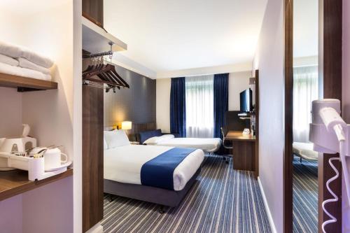 Ένα ή περισσότερα κρεβάτια σε δωμάτιο στο Holiday Inn Express Colchester by IHG