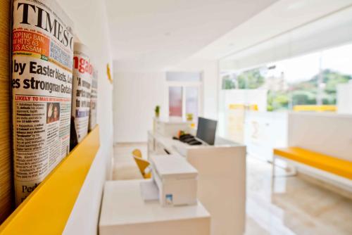 an office with a desk with a computer on it at X by Bloom I Hebbal Manyata Park in Bangalore