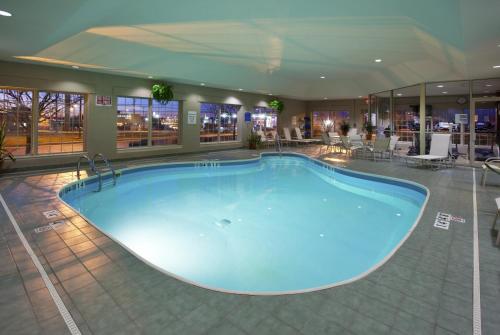 a large swimming pool in a hotel room at Holiday Inn Express Hotel & Suites Delaware-Columbus Area by IHG in Sunbury